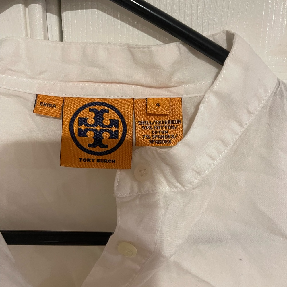 Tory Burch white half button blouse.